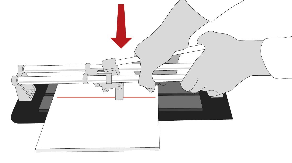 una persona corta cerámicas con una cortadora para cerámicas manual