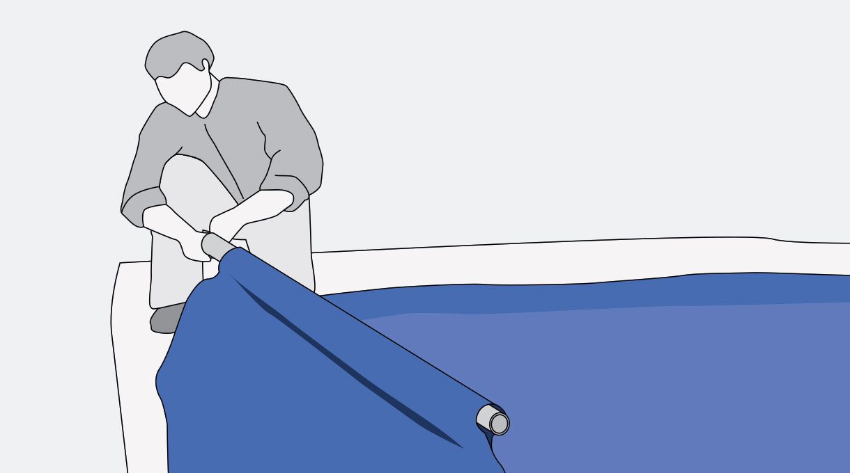 una persona instala los tubos perimetrales en una piscina estructural rectangular