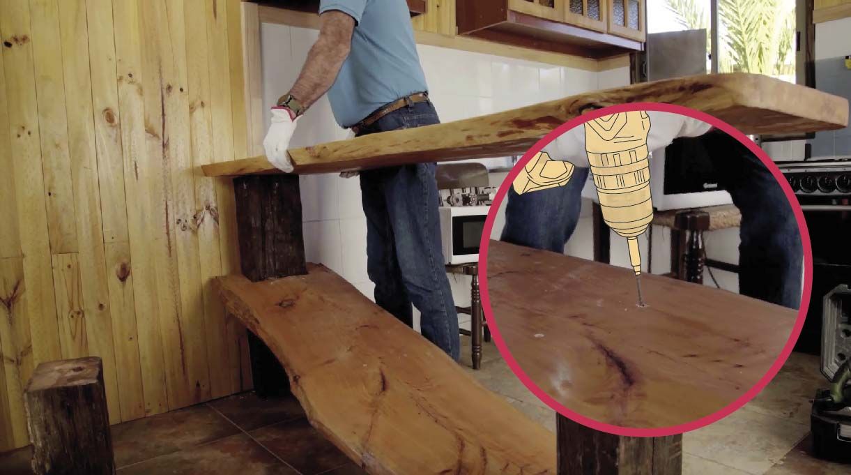 Usar el taladro inalámbrico para quitar las fijaciones que mantienen la mesa pegada al muro y las del tablón y pata del medio
