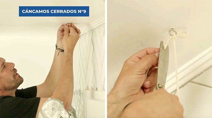 Una persona amarra el adorno colgante a unos cáncamos cerrados en el cielo