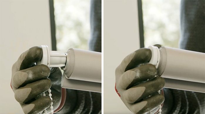 Una persona pone la rosca de la cortina roller en el tubo de aluminio