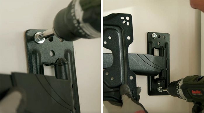 Se ve una persona atornillando el soporte para monitor en el muro