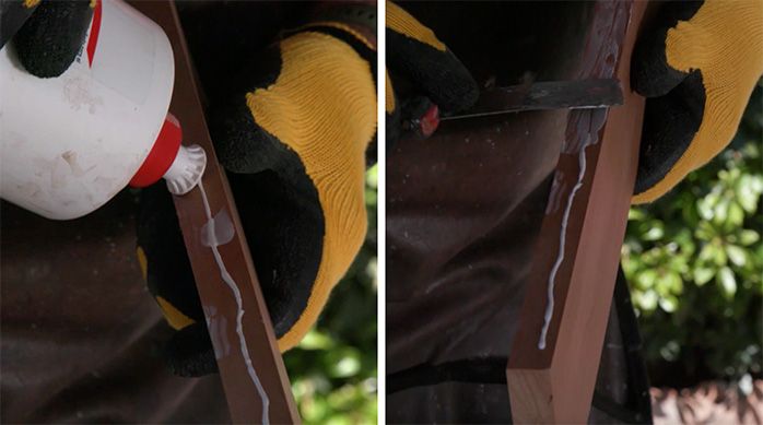Una persona pone un cordón de cola fría en el canto de una madera con una espátula