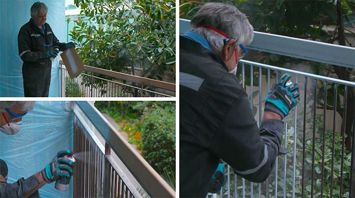Una persona aplica pintura en spray en la baranda de terraza o balcón