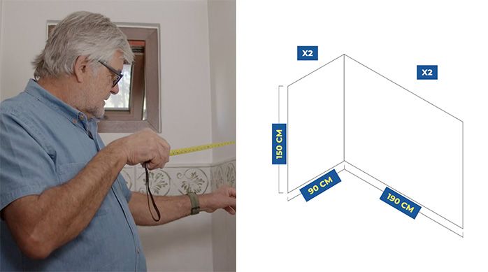 un hombre mide el ancho de una pared del baño de visitas