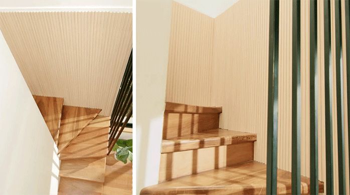 una escalera recién remodelada con revestimiento ranurado.