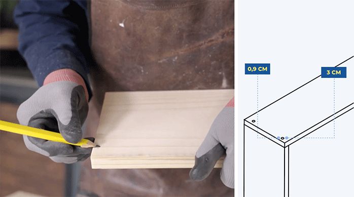 un hombre marca el lugar de fijación en un trozo de madera.