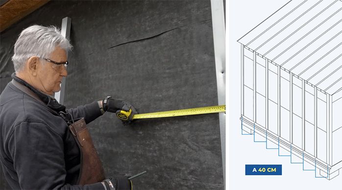 un hombre mide 40 cm desde el pilar de metalcon para instalar el segundo pilar.