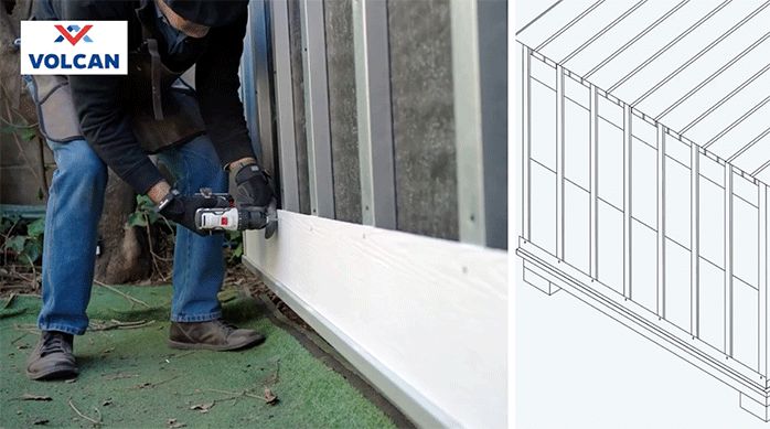 un hombre instala una plancha de siding de fibrocemento en el exterior de una casa.