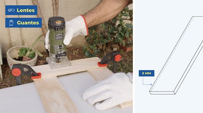 una persona usa una fresadora con fresa recta para hacer una ranura en una tabla de madera.