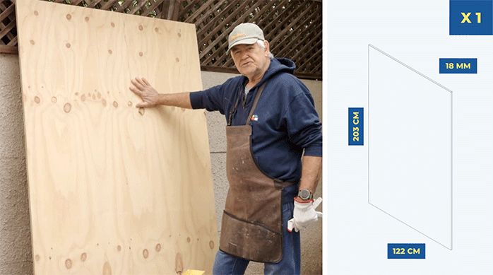 un hombre muestra una plancha de madera que usará para instalar la bodega encima.