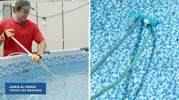 un hombre usa un limpiafondo para limpiar el fondo de la piscina.