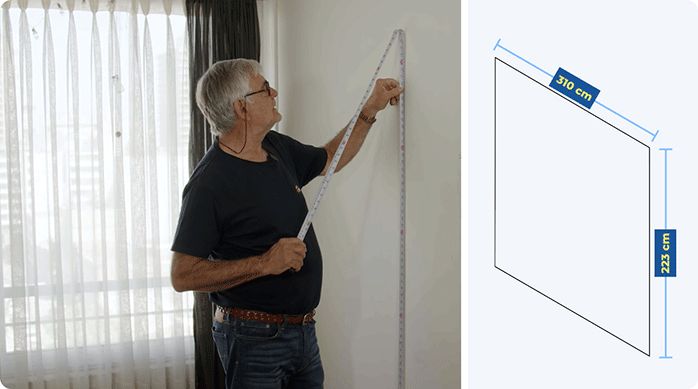 un hombre mide el muro de un dormitorio para luego revestirlo con listones de MDF.