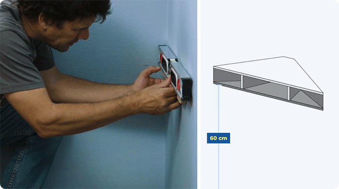 una persona usa un nivel de burbuja para nivelar bien el mueble esquinero en el muro de una habitación.
