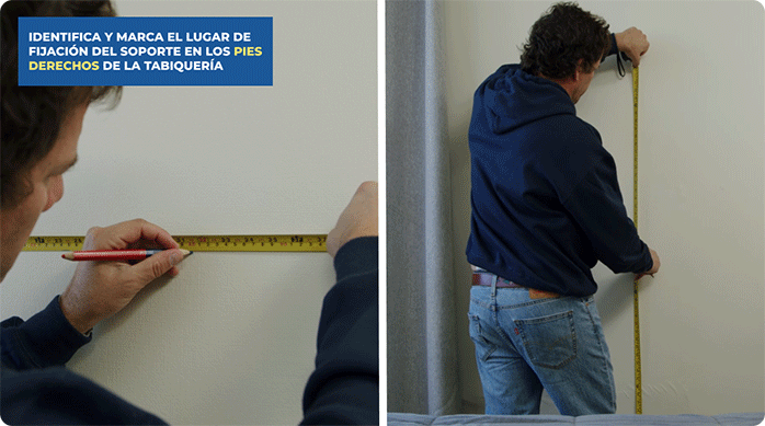 un hombre mide la altura a la que pondrá el soporte de tv en el muro de yeso cartón.