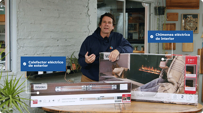 un hombre frente a una mesa en que hay un calefactor eléctrico de exterior y una chimenea eléctrica de interior.