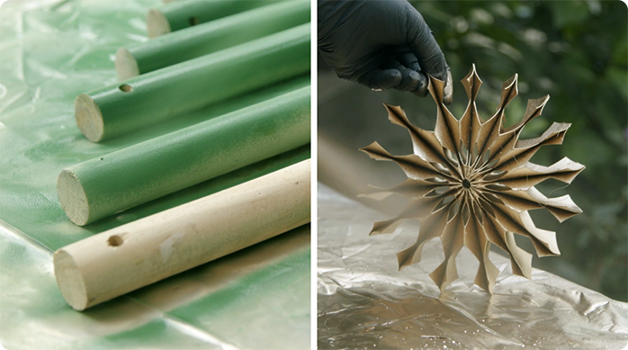 tarugos de madera pintados con spray verde y una estrella de Navidad de cartón pintada con spray dorado.