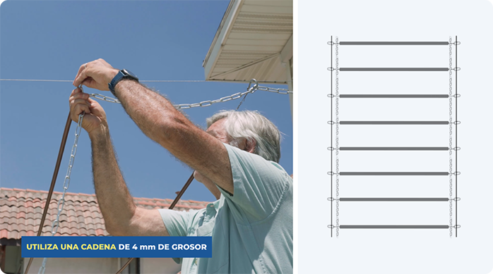 un hombre engancha una cadena en los cables principales de la pérgola retráctil para estacionamiento.