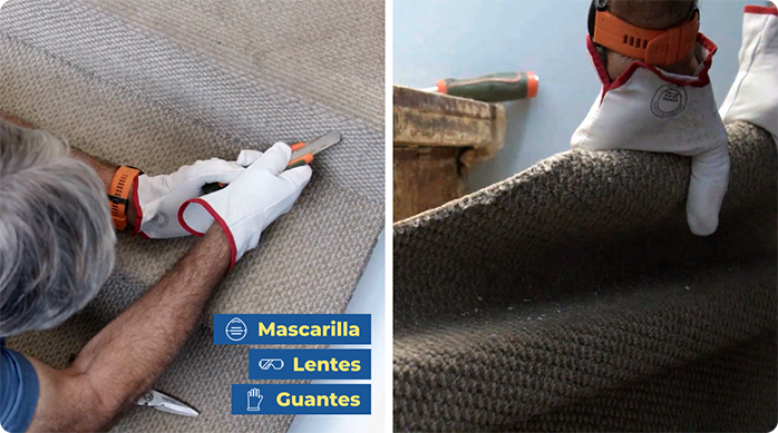 un hombre corta la alfombra de una escalera con un cuchillo cartonero y la saca con las manos.