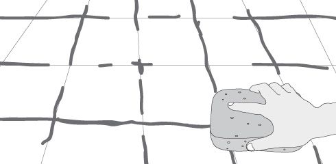 Limpia el excedente de adhesivo con una esponja, antes de que se seque